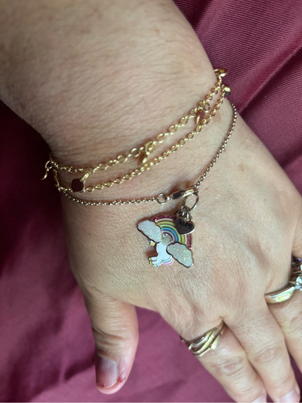 3 pc bundle of Gold-tone bracelets and Rainbow Unicorn Charm Bracelet by